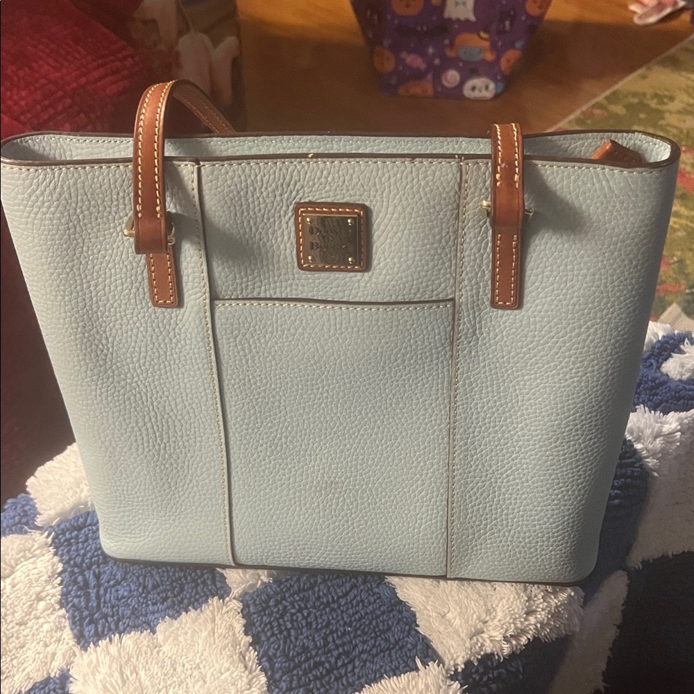 Dooney & Bourke Pale Blue Tote with Brown Straps. 
Pale Blue